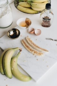 fresh bananas and bowl of raw egg