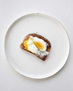 brown and white pastry on white ceramic round plate