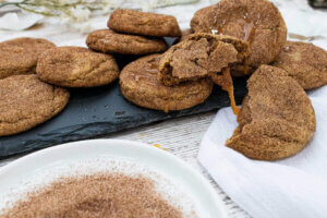 Dripping caramel stuffed snickerdoodle cookies