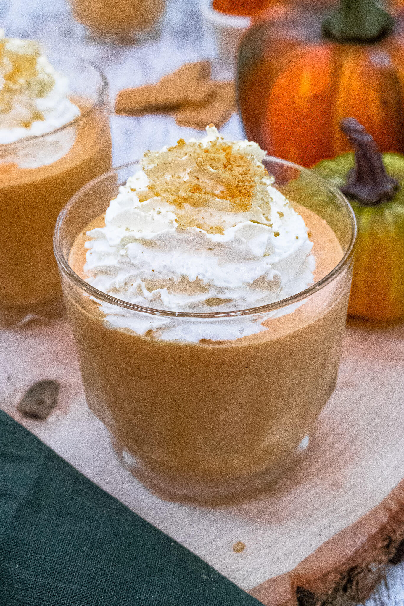 side view of orange pumpkin cheesecake smoothie