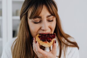 a woman eating bread