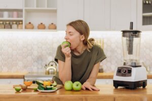 woman leaning on counter top