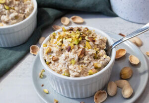 oatmeals with pistachios in a white bowl