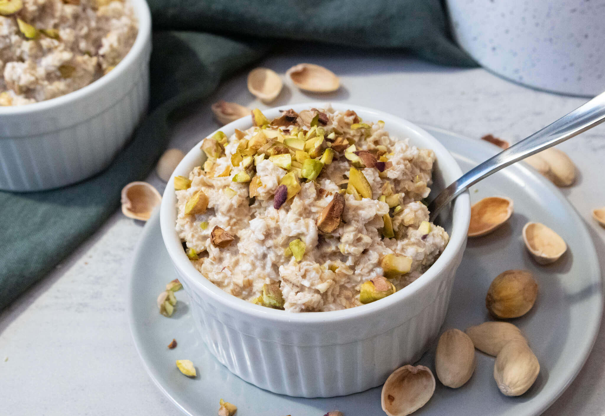 oatmeals with pistachios in a white bowl