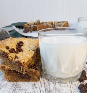 brown butter chocolate chip cookie bars with milk