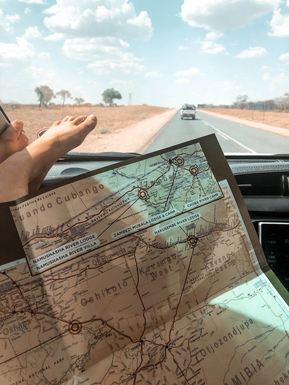 Road Trip Snacks Non Refrigerated with person holding map in car