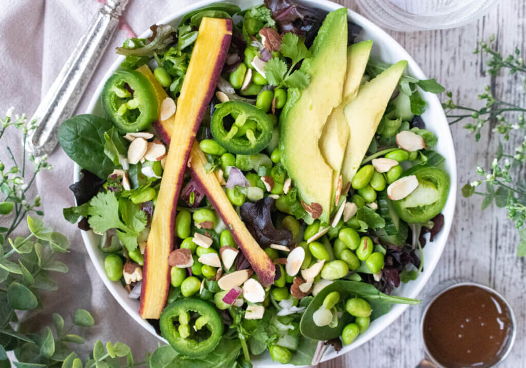 edamame salad on a table with fork