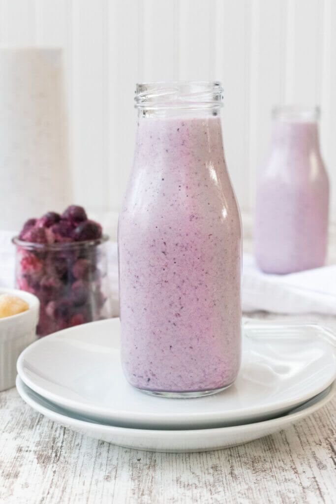 Berry protein smoothie in a milk container