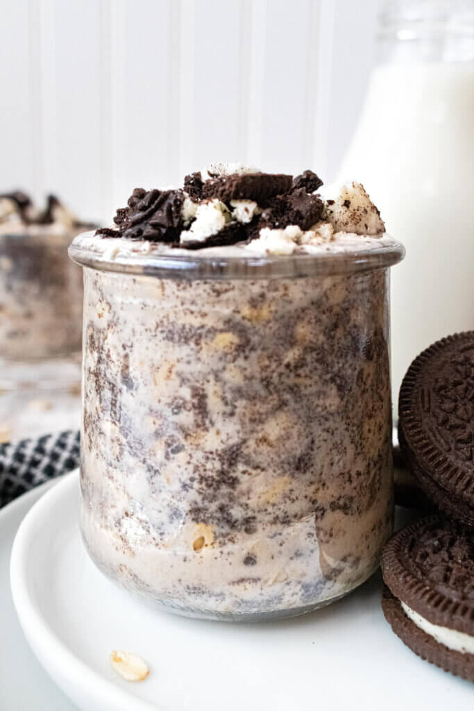 Side view of oreo overnight oats in small glass container