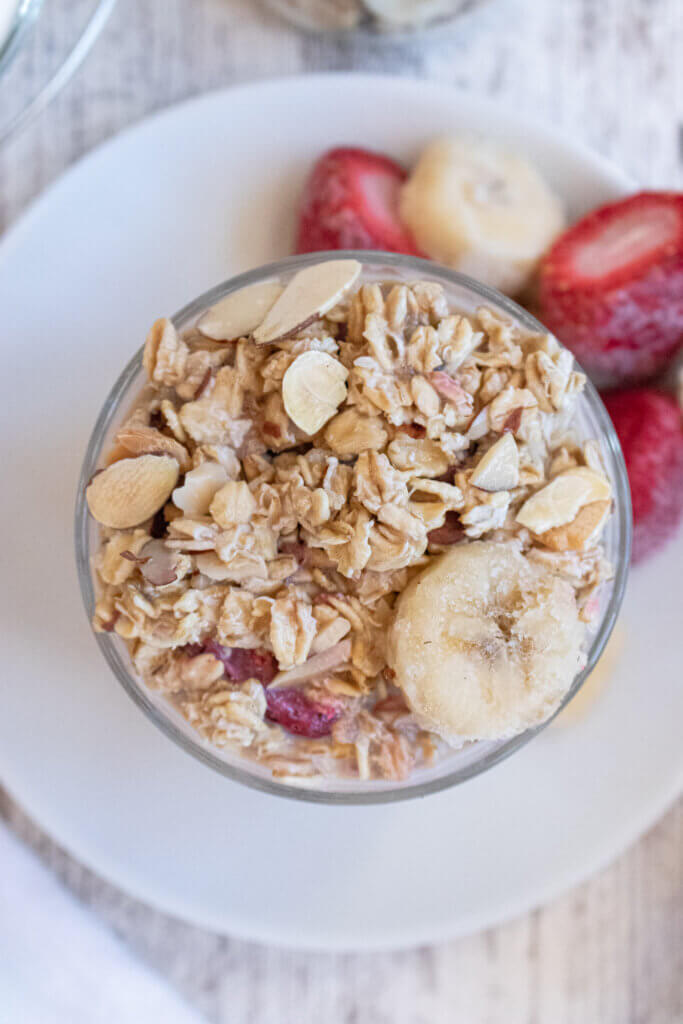 Overnight oats with frozen fruit  on white plate