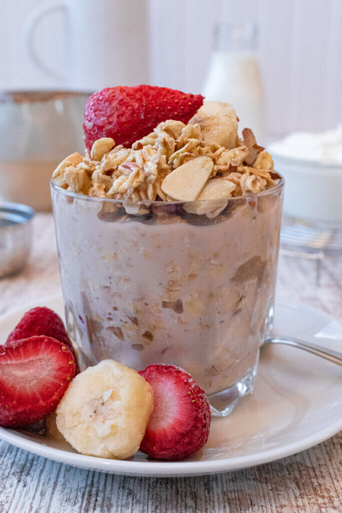 Overnight oats with frozen fruit topped with strawberry