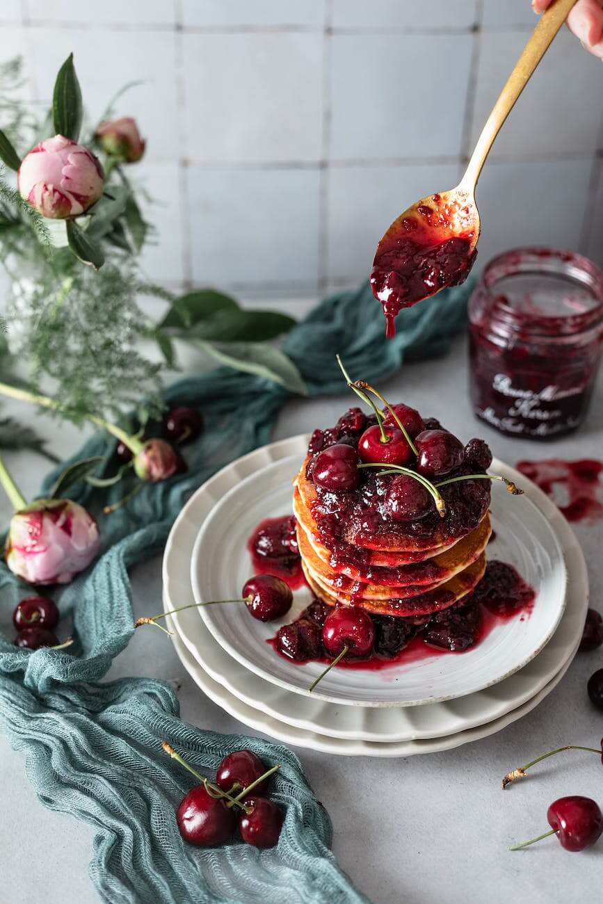 photo of pancakes with cherry jam