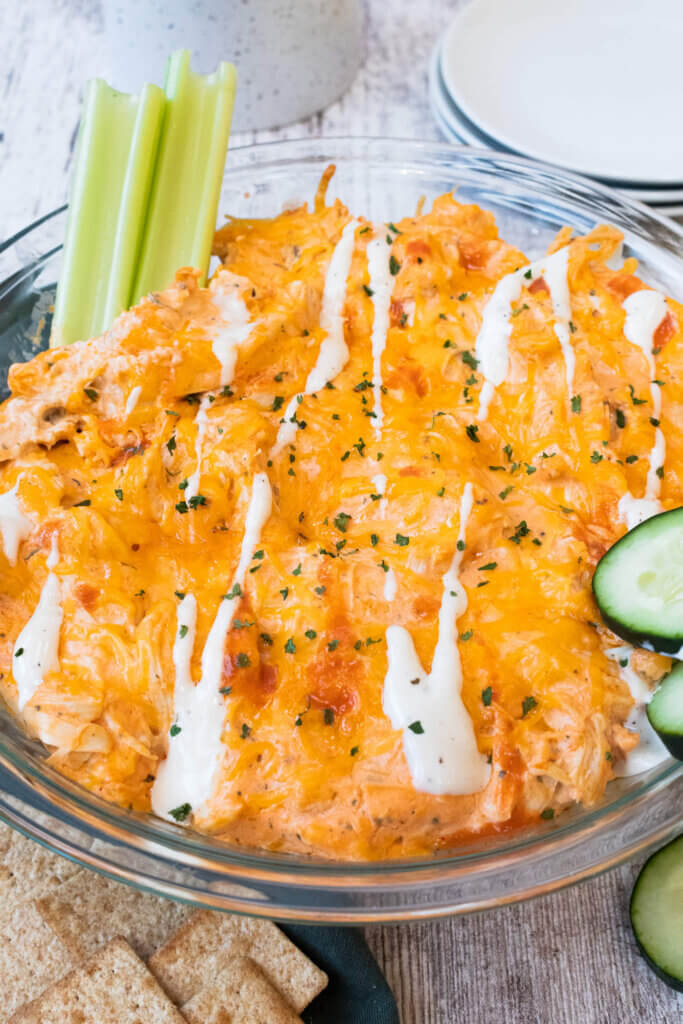 close up of buffalo chicken dip with greek yogurt in casserole dish