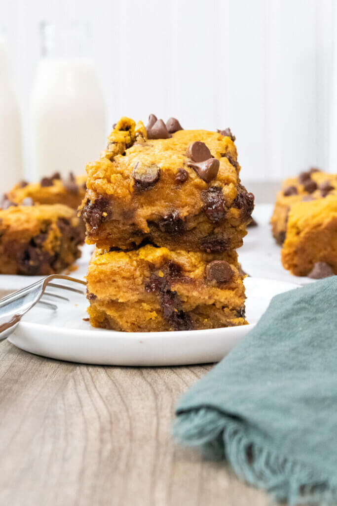 stacked pumpkin chocolate chip bars on a small plate