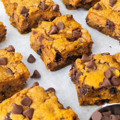 pumpkin chocolate chip bars on parchment paper