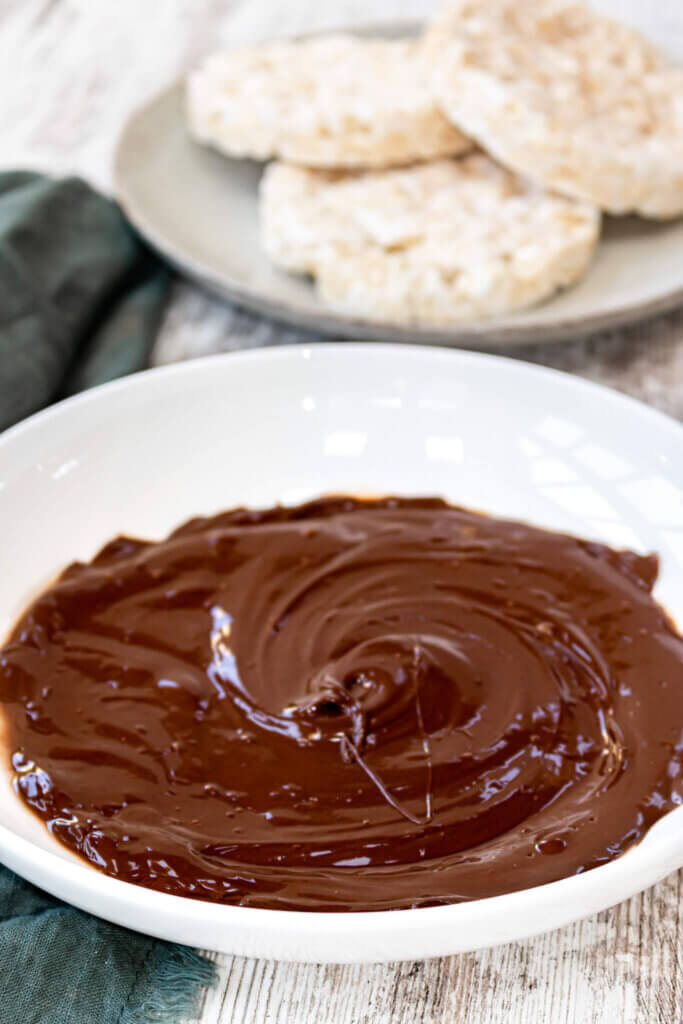 Melted chocolate in a white bowl