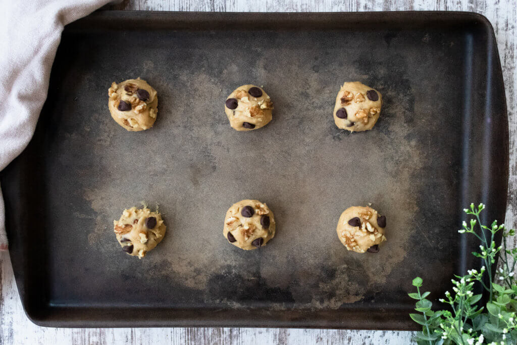 chocolate chip walnut cookie dough ball on baking stone