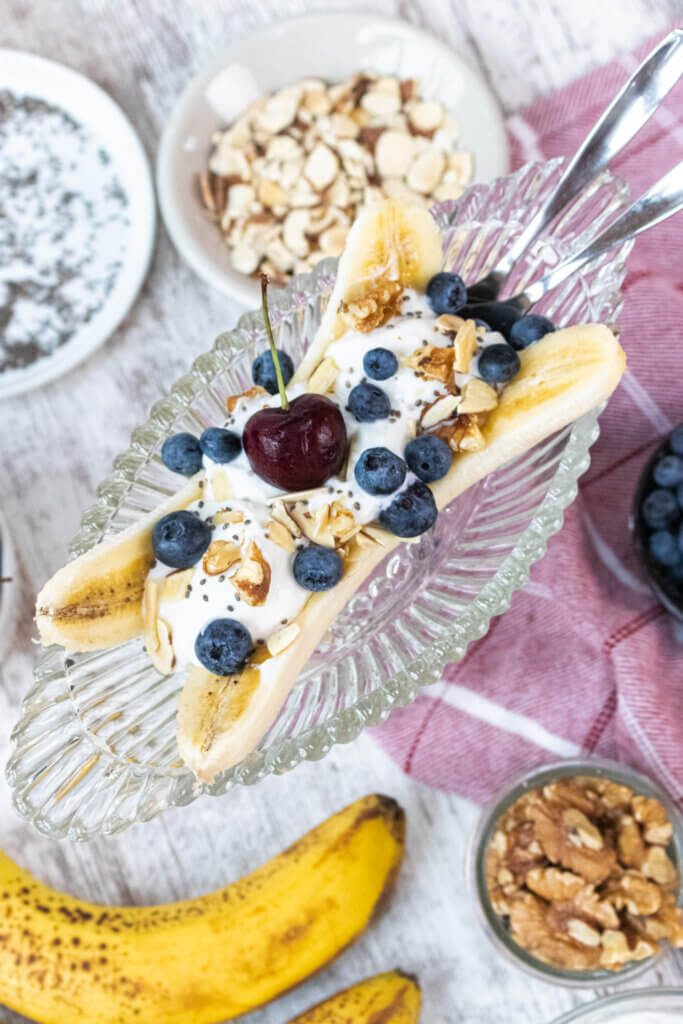 Healthy Banana Split Parfait in a glass bowl