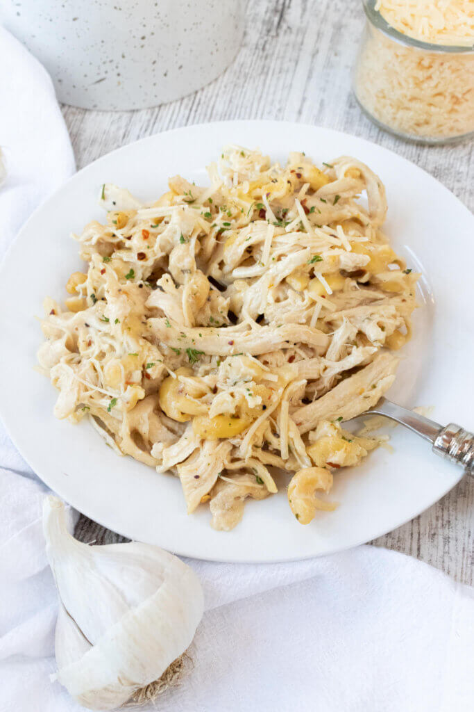 Crockpot Garlic Parmesan Chicken Pasta on white plate