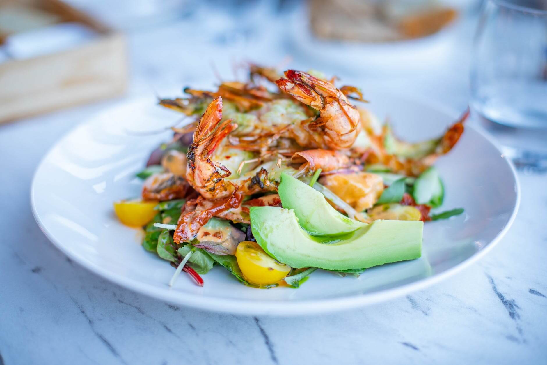 shrimp dish with vegetable salad in a plate