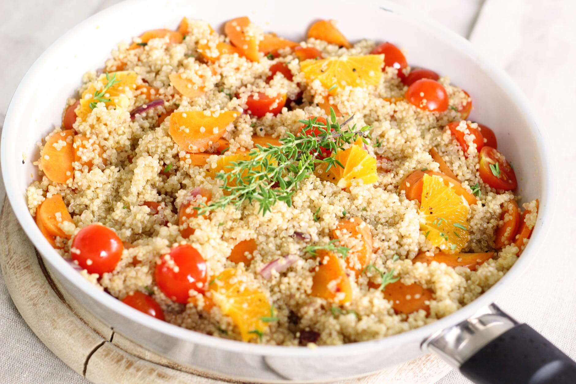 close up of salad toppings in bowl with rosemary