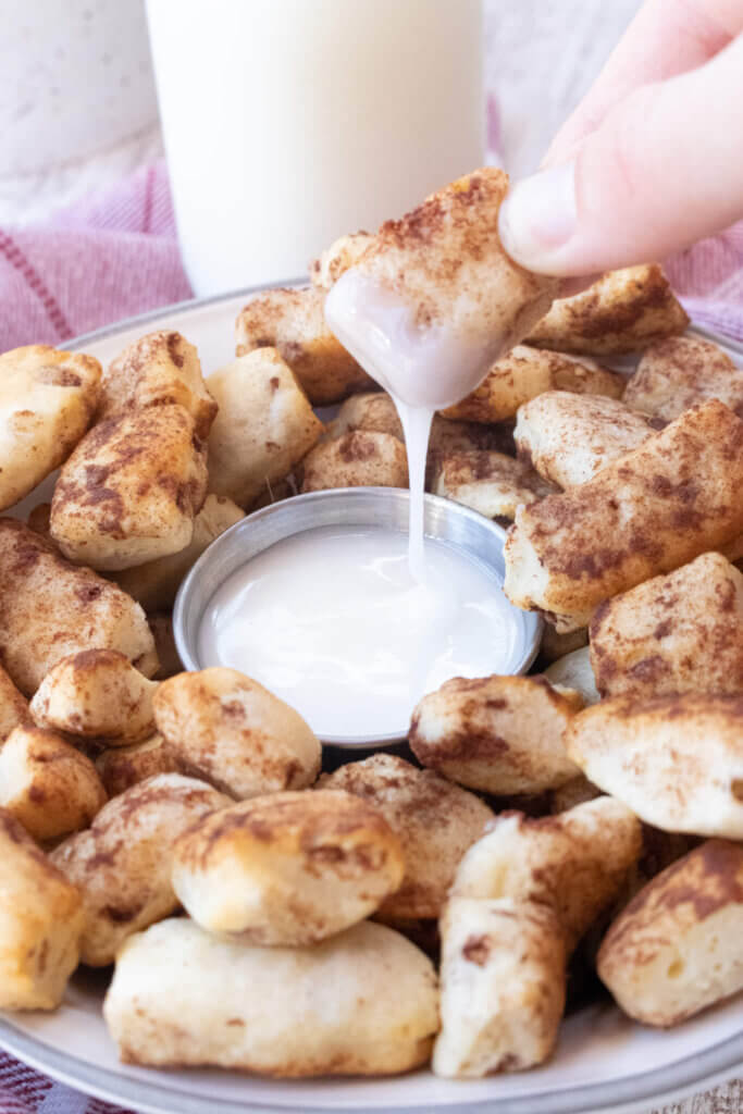 Air fryer cinnamon roll bites with icing