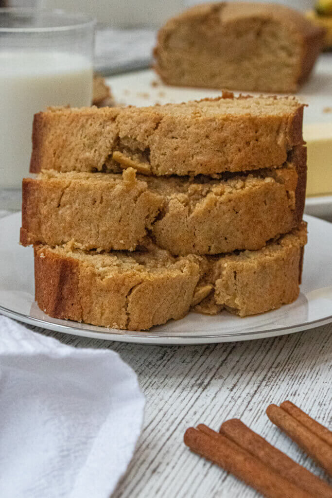 banana bread without baking soda stacked on white plate