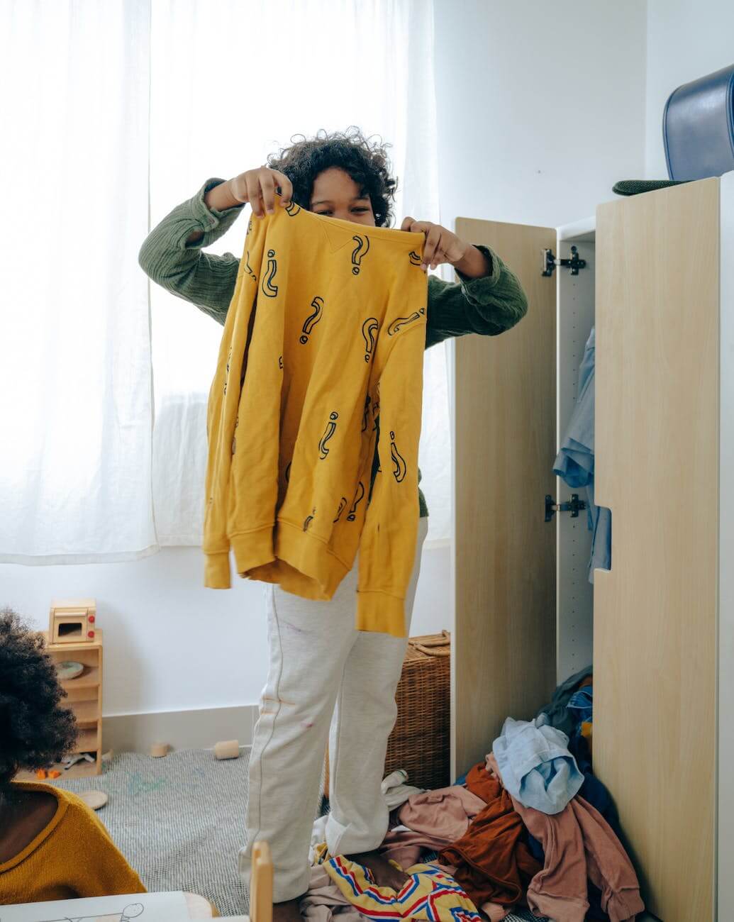 black teenager cleaning closet to ditch dieting