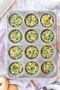 kale and mushroom egg bites in a muffin tin