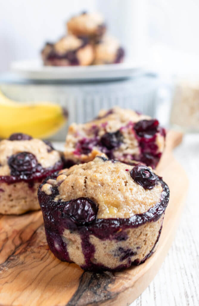 Oatmeal Blueberry Banana Muffins on cutting board