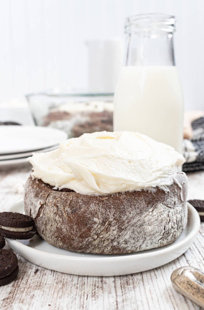 Oreo Cinnamon Roll with icing and glass of milk