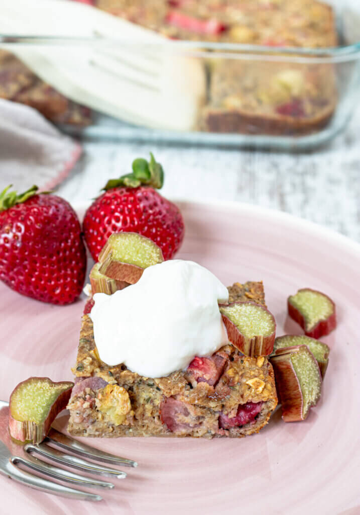 Strawberry Rhubarb Baked Oatmeal topped with vanilla yogurt