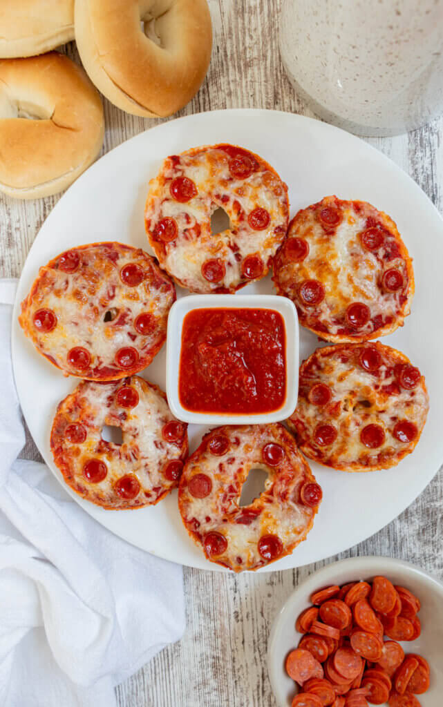 Mini pepperoni air fryer pizza bagels on white plate