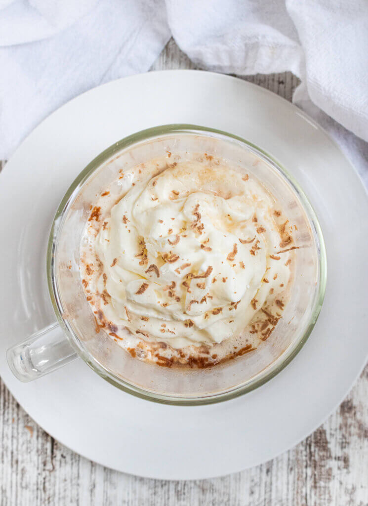 Cadbury hot chocolate with whipped cream and chocolate shavings