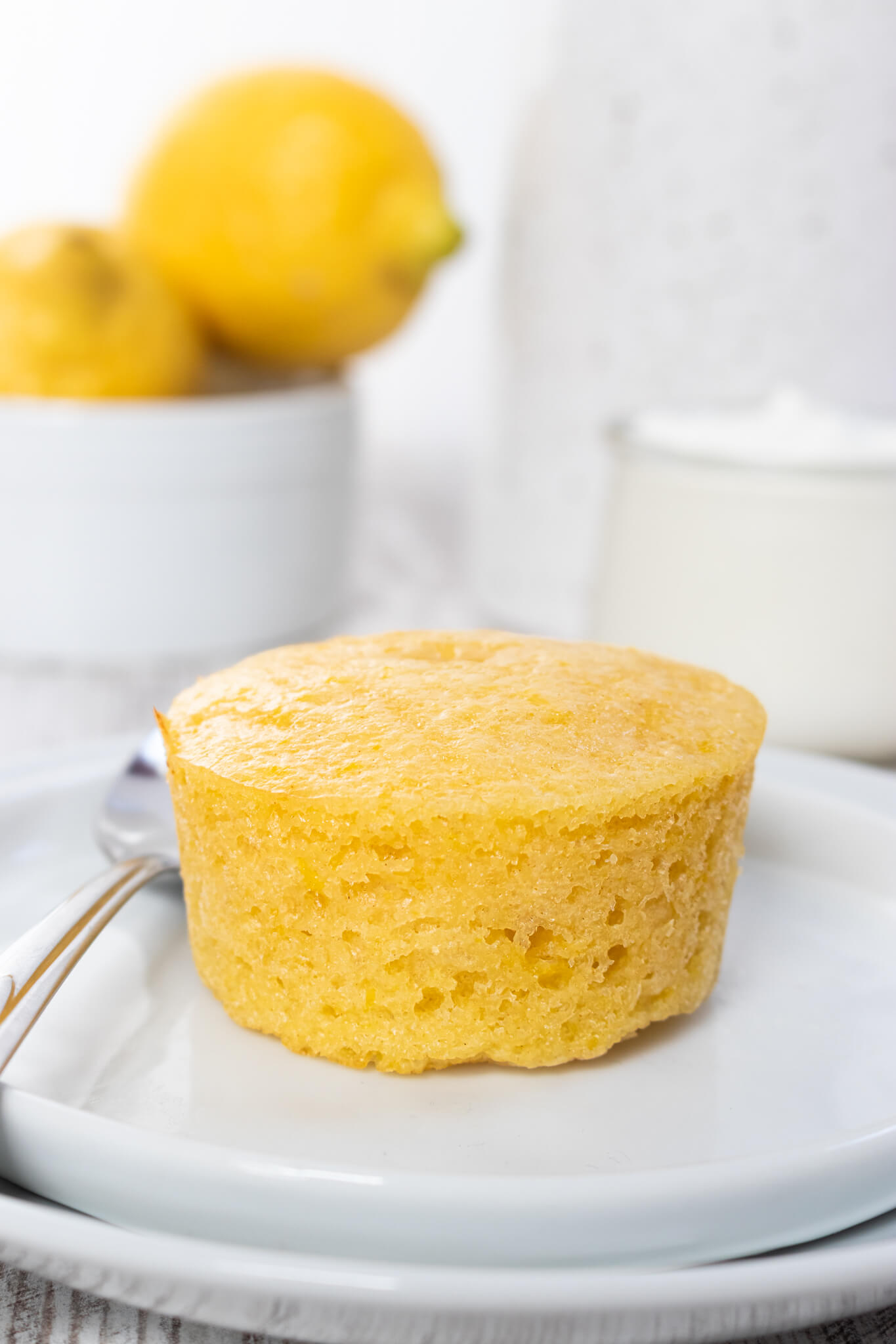 Lemon Yogurt Muffins on two white plates