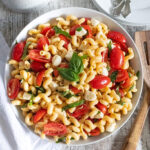 easy caprese pasta salad in white bowl