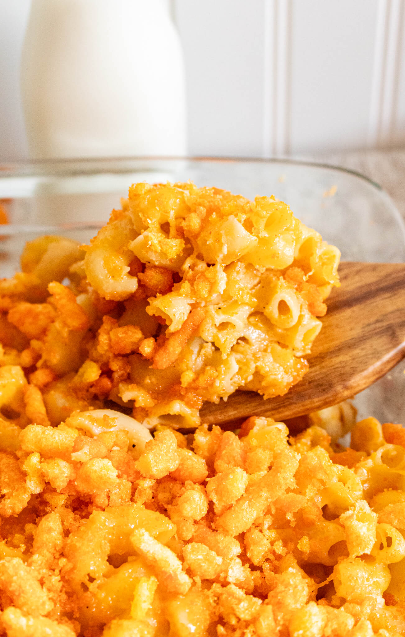 Mac and cheese on a wooden spoon