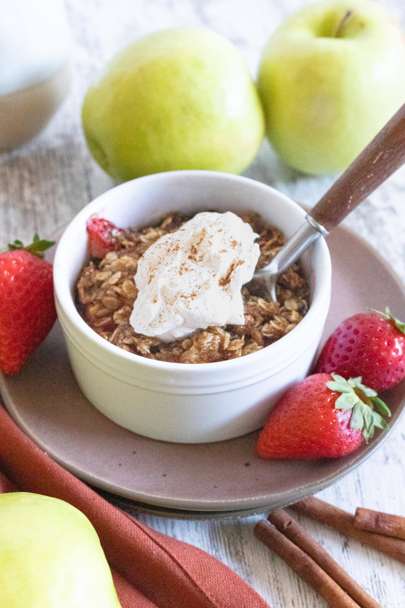 Strawberry Apple Crisp for one topped with cool whip