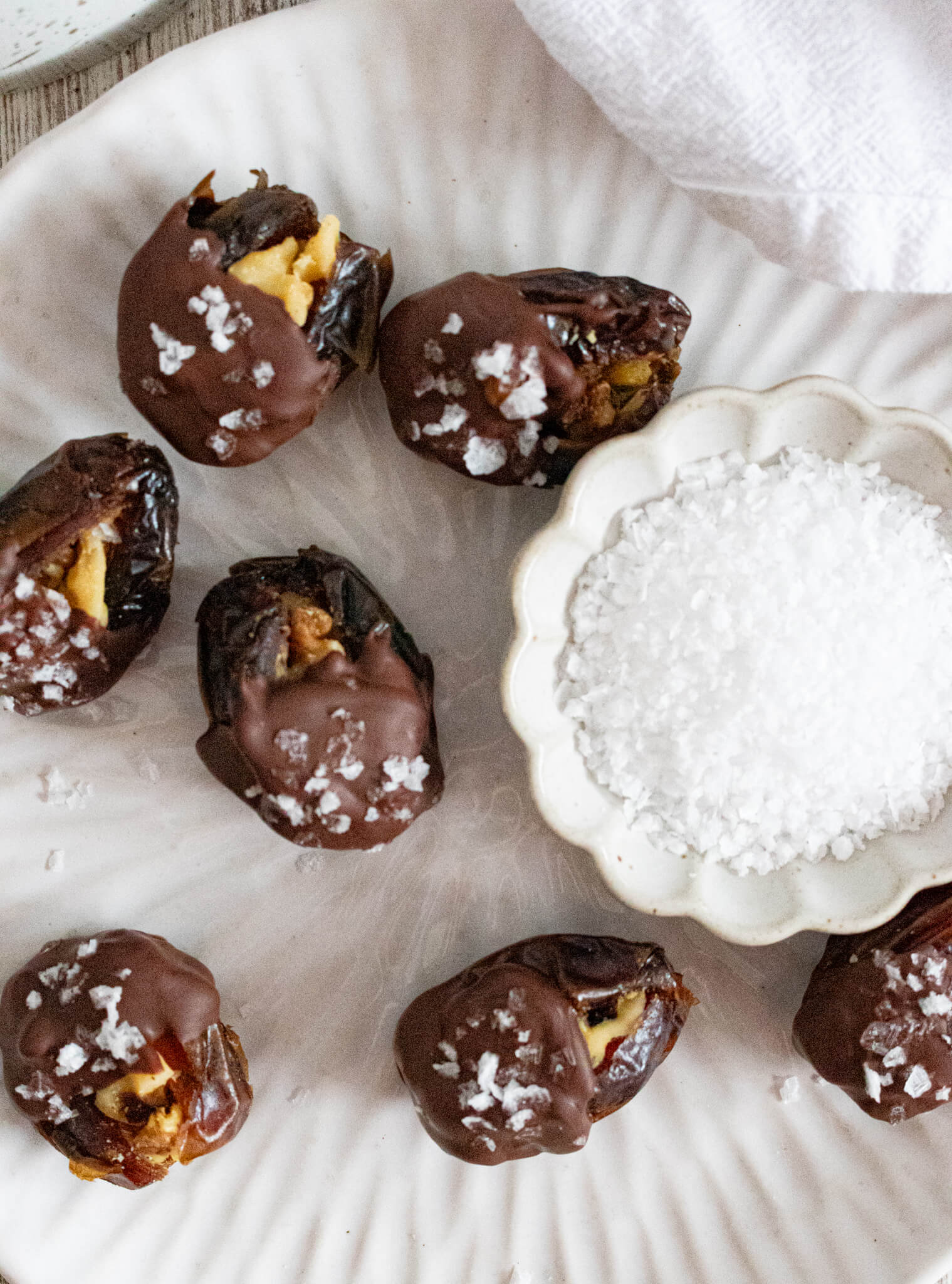 Walnut stuffed dates dipped in chocolate with flakey salt